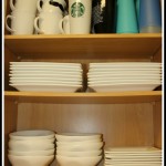white dishes in a cupboard