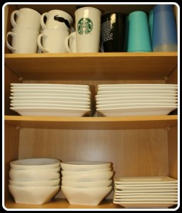 white dishes in a cupboard