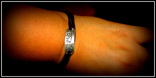 leather and silver sanskrit engraved bracelet