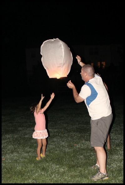 pushing lantern into the sky