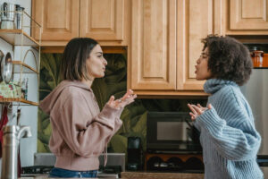 Multiethnic women having a conflict in the kitchen